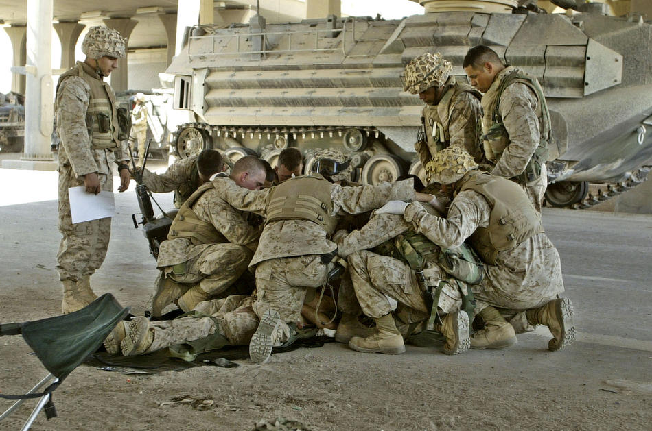 Impromptu moment pf prayer - Marines pray for a killed brother-in-arms, Fallujah, Iraq. (Twitter)