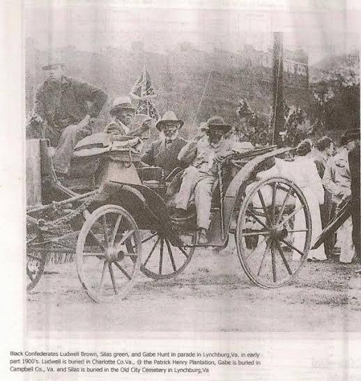Black Confederate veterans in turn of the century Lynchburg, VA. Note the white man who's doing the driving for the three vets. (Facebook) 